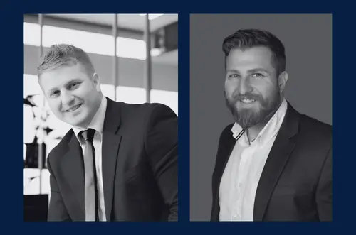 Two black-and-white portraits of men in suits displayed side by side on a dark blue background.